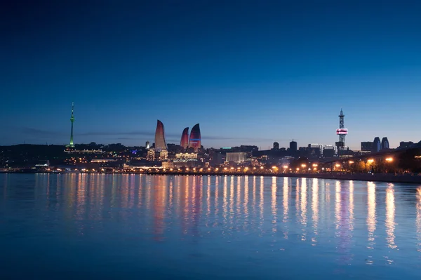 Nice view of the city at night by the sea Stock Picture