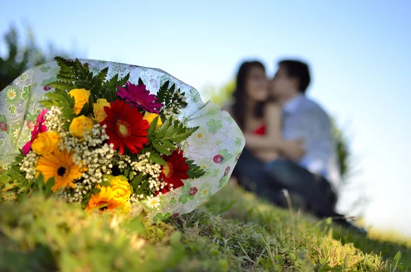 Behind a bouquet of flowers — Stock Photo, Image