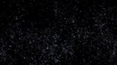 Güzel, parlak, beyaz parçacıklar gece karanlığında parıldıyor.. 