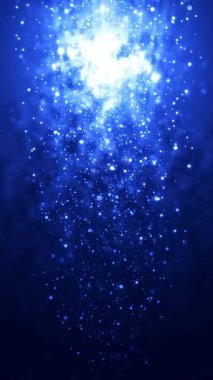 Parlak parçacıklar koyu mavi bir alanda parıldıyor ve göz kamaştırıcı bir manzarayla aşağıya doğru çağlıyor. Telefonlar için dikey duvar kağıtları.