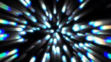 Parlak, mavi ışıklar karanlık bir merkezden hızla dışarı doğru hareket eder gibi görünüyor..