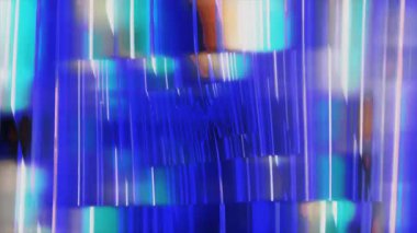 Soyut şekiller şekil değiştirir ve karışır. Canlı, hareketli renkler yaratır. Hipnotik ve yavaş bir desen içinde..