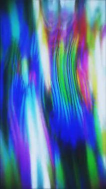 Dalgalı, soyut renkli ışık çizgileri hareket ediyor.
