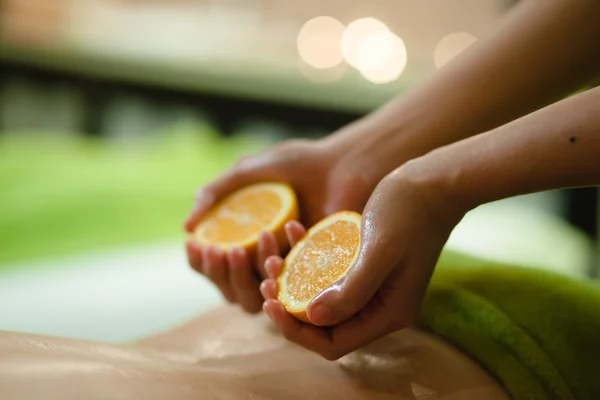 Massage with oranges Stock Picture