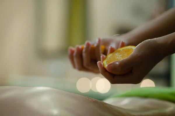 Massage with oranges Stock Image