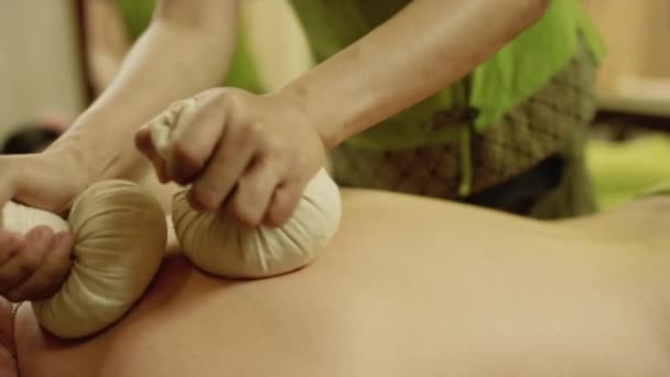 Herbal compress massage — Stock Video