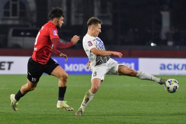 Zhytomyr, Ukraine 13 december 2025. Yaroslav Karabin of Karpaty vs Oleksandr Filippov of Polissya in action during the Ukrainian Premier League match between FC Polissya Zhytomyr vs FC Karpaty Lviv