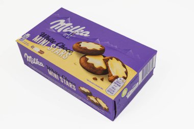 Lviv Ukraine 12.07.2025 A purple box of Milka mini stars sits on a white surface. The box contains chocolate cookies with cream filling shaped like stars.