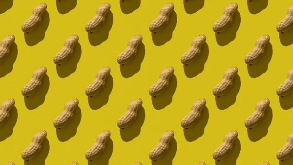 Απρόσκοπτη μοτίβο των αραχίδων σε κίτρινο φόντο. — Φωτογραφία Αρχείου
