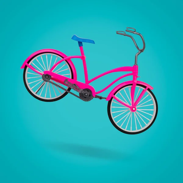 Bicicleta roja con montura azul sobre fondo azul. — Foto de Stock
