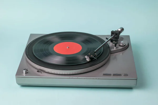 Gray turntable on a light blue background. — Stock Photo, Image