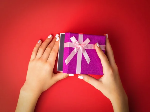 Child Hands Open Gift Box Red Background Surprise Hands Girl — Stock Photo, Image