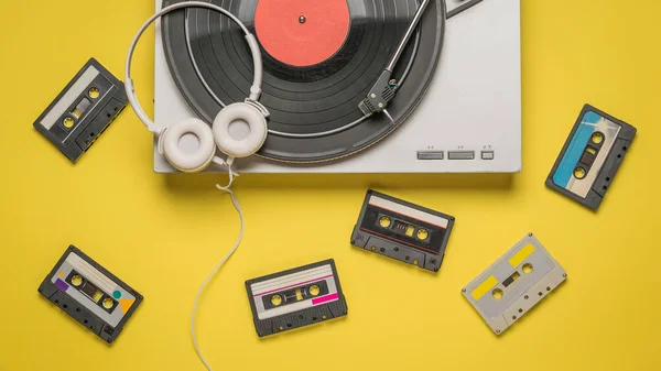 Tape Cassettes Vinyl Record Player Headphones Yellow Background Retro Equipment — Stock Photo, Image