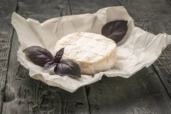Fresh Camembert Cheese Paper Basil Leaves Wooden Table Product Made — Fotografia de Stock