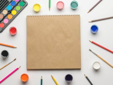 A beautiful plate with camembert cheese, berries and bread on a wooden table. Accessories for creativity.