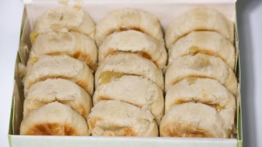 Bakpia is a flat, round cake made from a mixture of chocolate and sugar, wrapped in flour dough, and baked. It's a popular souvenir from Yogyakarta.