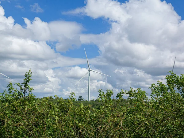 Wind Turbines Green Hilly Terrain Bright Blue Sky — Stock Photo, Image