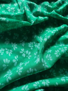 white floral fabric background and pattern and pleated lines with green base color