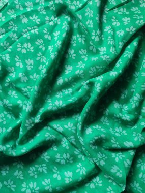 white floral fabric background and pattern and pleated lines with green base color