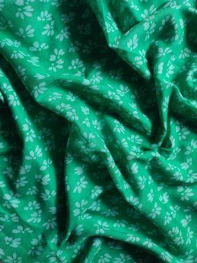 white floral fabric background and pattern and pleated lines with green base color