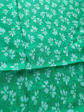 white floral fabric background and pattern and pleated lines with green base color