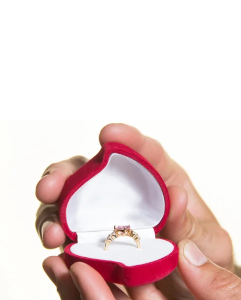Ring in an open box in a man's hand, the proposal - isolate — Stock Photo, Image