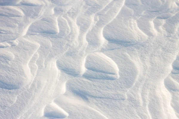 Fond vagues de neige au coucher du soleil par le vent — Photo