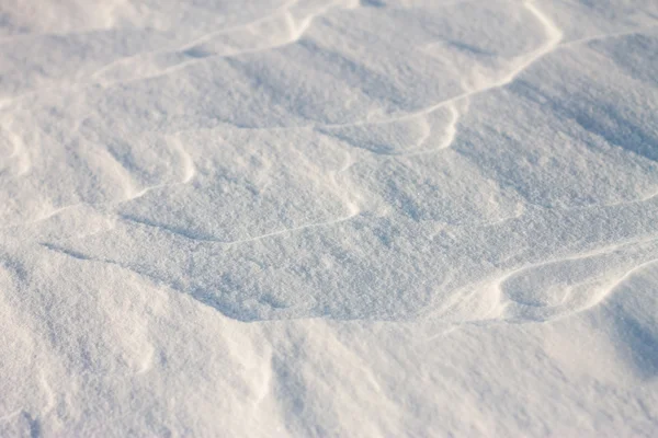 Sfondo onde di neve al tramonto dal vento — Foto Stock