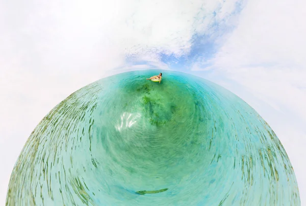 Girl in inflatable ring floating in the azure sea — Stock Photo, Image