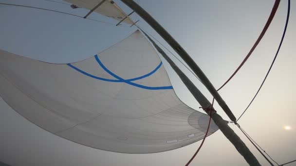 White sails of a yacht against a cloudy sky — Stock Video