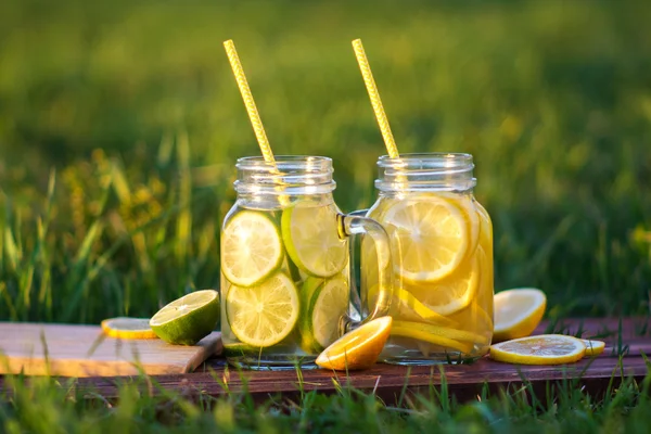 Homemade lemonade with lime, mint in a mason Jar, lifestyle — Stock Photo, Image