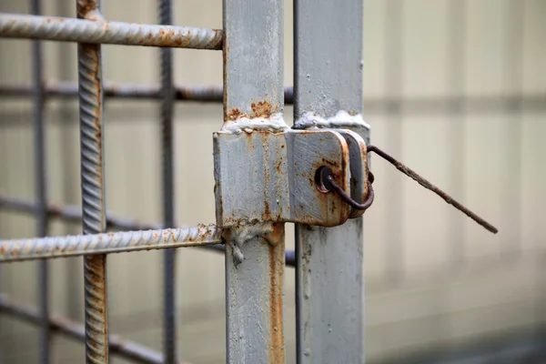 Grates locked with a metal hook — Stock Photo, Image
