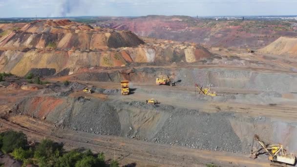 Heavy mining machinery in a quarry aerial view. — Stock Video