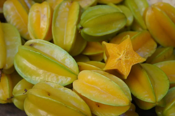 Starfruits with star-shape slise — стоковое фото