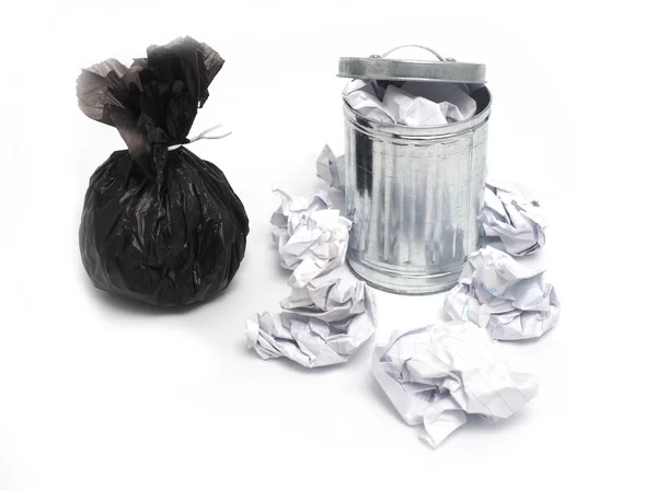 Metal garbage bin and paper trash on white background — Stock Photo, Image