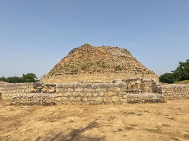 Ancient Dharmarajika stupa ruins under sunlight at Taxila