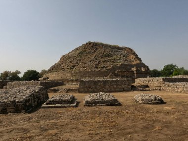 Dharmarajika stupa Taxila with small votive stupas built by ancient monks in front of main Buddhist monument
