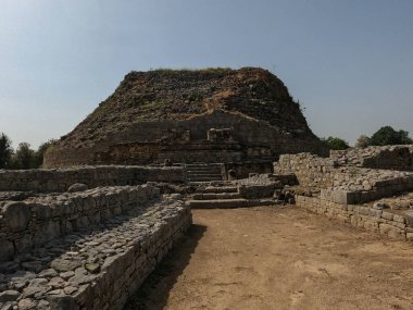 Dharmarajika stupa ruins in Taxila showing ancient Buddhist site where mostly old stone walls remain from past centuries