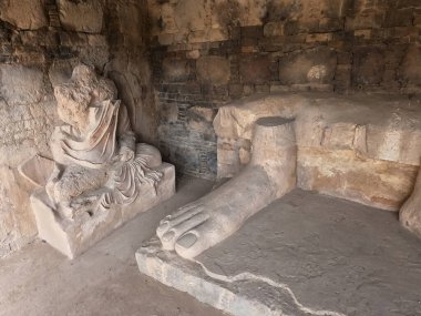 Buddha feet sculpture at ancient Dharmarajika stupa Taxila Pakistan showing Gandhara art heritage and sacred history