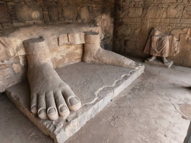 Sacred Buddha feet relic in Dharmarajika ruins Taxila Pakistan representing devotion history and peaceful spirituality