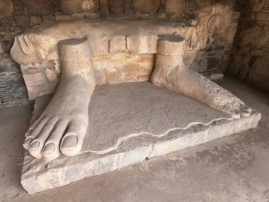 Buddhist relic Buddha feet sculpture Dharmarajika stupa Taxila Pakistan symbol of ancient faith and cultural legacy