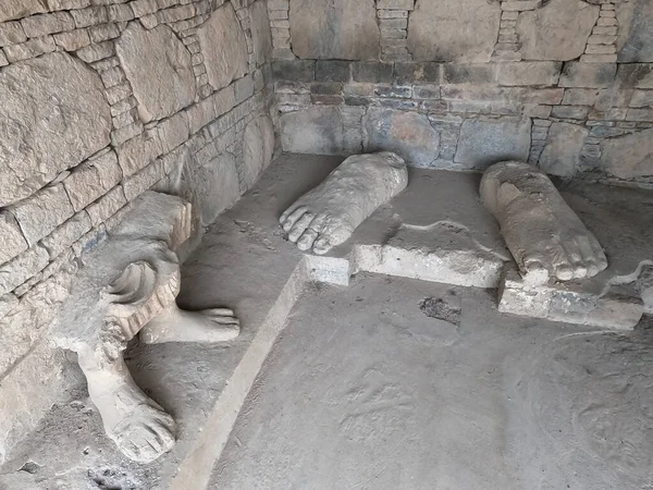 Buddha feet carved in ancient Dharmarajika site Taxila Pakistan showing sacred Buddhist heritage and spiritual symbolism