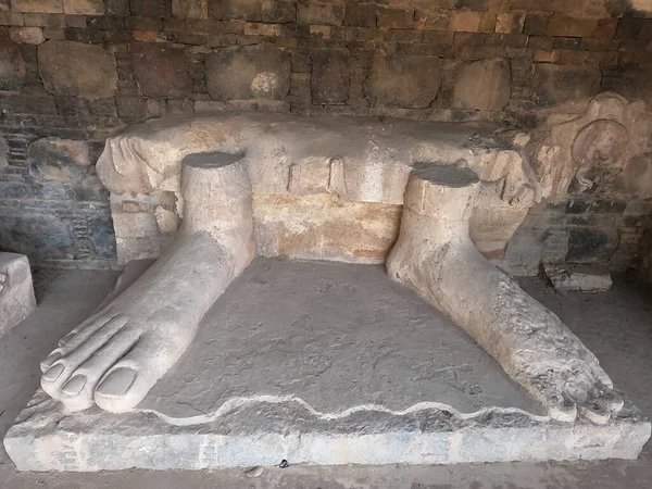 Ancient stone carving of Buddha feet in Dharmarajika Taxila Pakistan symbol of spirituality and historic devotion