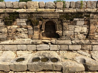 Dharmarajika main stupa statue niche with four holes symbolizing ancient buddhist relic placement in taxila pakistan