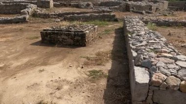 Dharmarajika complex view showing ancient stone walls and small stupas reflecting Buddhist faith and Gandhara heritage in Taxila ruins