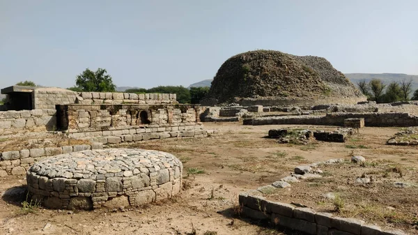 Small votive stupas at Dharmarajika ruins built by devotees to fulfill wishes and express gratitude