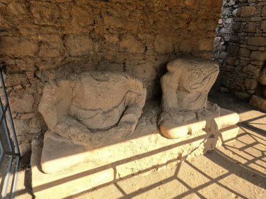 Heritage Seated Buddhist statues showing artistic erosion and monastic life in Taxila ruins Pakistan