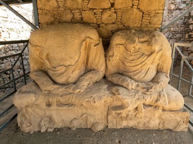 Heritage Twin seated Buddha statue fragments in Gandhara monastery Mohra Muradu Taxila ruins Pakistan