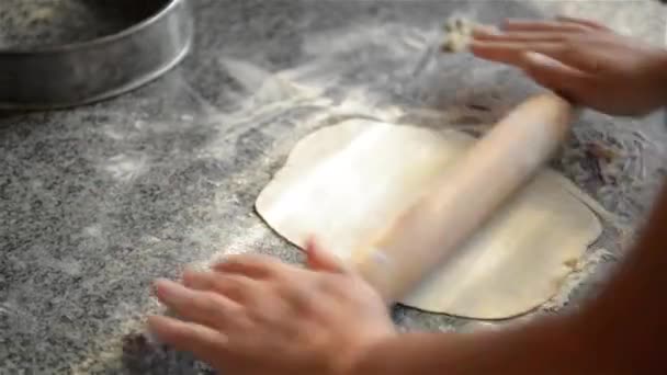 Woman rolls the dough into a professional kitchen — Stock Video