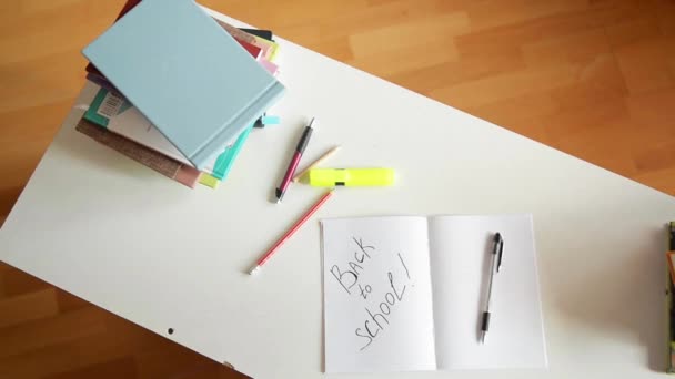 Students table with school supplies on it — Stock Video